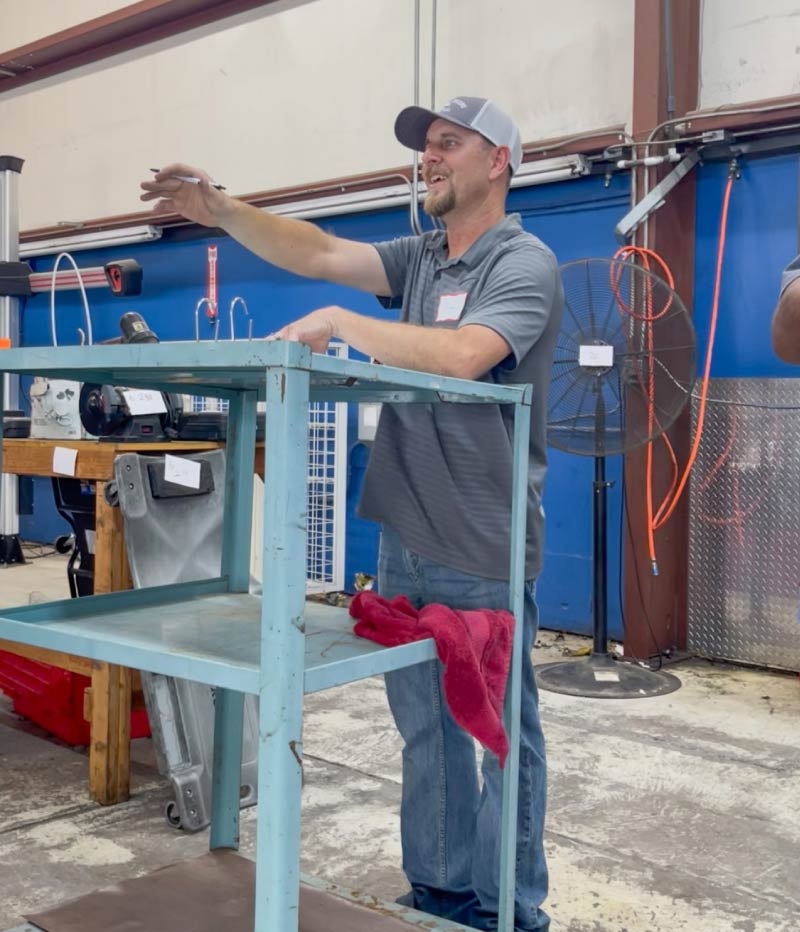 Tim Kacerek, owner of Big Valley Auction Co., actively conducting a live commercial liquidation auction in California.